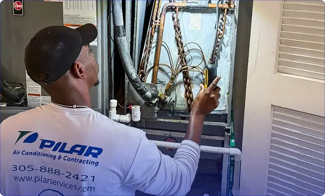 Residential HVAC technician at work